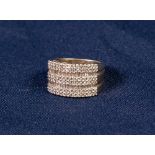 9ct GOLD AND DIAMOND HALF HOOP RING, in the form of three conjoined rings, each with a two row