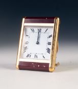 CARTIER, CIRCA 1980's GITL METAL AND MAROON ENAMEL BEDSIDE OR TRAVEL CLOCK, with quartz movement,