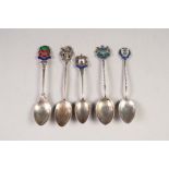 FIVE HALLMARKED SILVER SOUVENIR SPOONS, with tops shaped and enamelled with City crests including