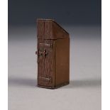 VICTORIAN BRONZE NOVELTY VESTA BOX in the form of an outside toilet, with hinged lid and hinge