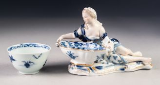 LATE NINETEENTH/ EARLY TWENTIETH CENTURY MEISSEN BLUE AND WHITE PORCELAIN FIGURAL SALT, heightened