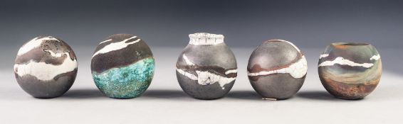 BABS TAYLOR, COLLECTION OF FIVE RAKU FIRED STUDIO POTTERY 'SMOKE BALLS' three of near spherical form