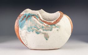 MAGGIE BARNES? STUDIO POTTERY VASE, of elliptical organic form, glazed in blue on an off-white