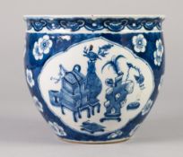 A CHINESE LATE QING DYNASTY PORCELAIN SMALL BLUE AND WHITE JARDINIERE painted with shaped panels