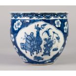 A CHINESE LATE QING DYNASTY PORCELAIN SMALL BLUE AND WHITE JARDINIERE painted with shaped panels
