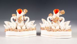 PAIR OF NINETEENTH CENTURY STAFFORDSHIRE POTTERY SPILL VASE GROUP, each heightened in colours and