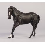 ROYAL DOULTON CHINA MODEL OF BLACK BEAUTY, modelled with front left leg raised, printed mark, 7" (