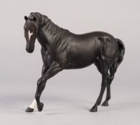 ROYAL DOULTON CHINA MODEL OF BLACK BEAUTY, modelled with front left leg raised, printed mark, 7" (