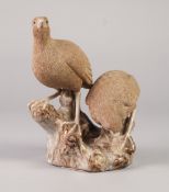 A TWENTIETH CENTURY CHINESE PORCELLANEOUS WARE MODEL OF TWO QUAIL, in finely incised biscuit