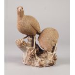 A TWENTIETH CENTURY CHINESE PORCELLANEOUS WARE MODEL OF TWO QUAIL, in finely incised biscuit