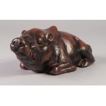 A JAPANESE EDO PERIOD RED STONEWARE MODEL OF A RECUMBENT BOAR, impressed seal mark, 8" (20.5cm)