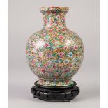 A CHINESE LATE QING DYNASTY PORCELAIN GLOBULAR VASE, painted autour in polychrome enamels with