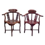 A LATE TWENTIETH CENTURY CHINESE HARDWOOD YOKE BACK CORNER CHAIR, with dragon carved splats and