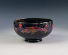 WALTER MOORCROFT 'POMEGRANATE' PATTERN TUBE LINED POTTERY BOWL, of steep sided, footed form,