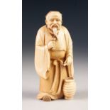 GOOD JAPANESE MEIJI PERIOD ONE PIECE CARVED IVORY BEARDED MALE FIGURE, holding a goblet in his