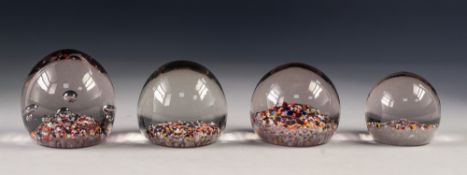 FOUR 'END OF DAY' GLASS PAPERWEIGHTS, including one with bubble inclusions, 3 ¼" (8.2cm) high and