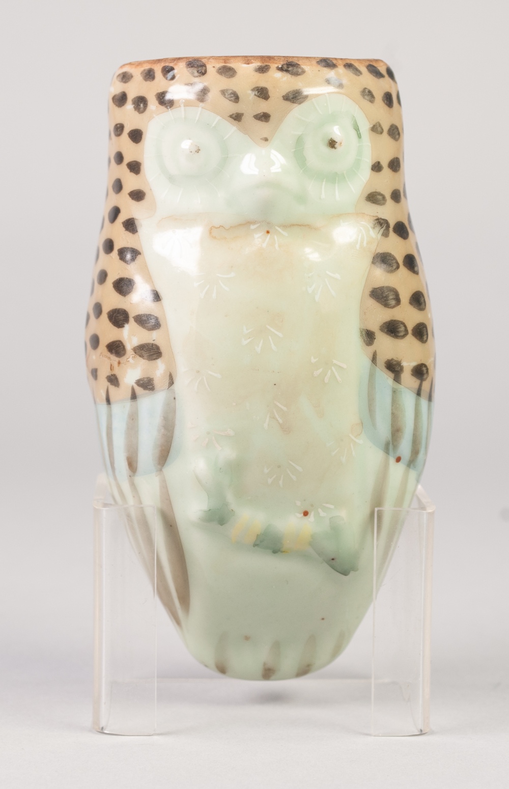 AN ORIENTAL CELADON GLAZE 'OWL' FORM WALL POCKET, accentuated with enamelling, 7" (17.5cm) long