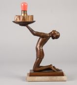 ART DECO PATINATED BRONZE FIGURAL TABLE LAMP, modelled as a kneeling female figure with head back