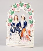 NINETEENTH CENTURY STAFFORDSHIRE FLAT BACK POTTERY 'VICTORIA AND ALBERT' ARBOUR GROUP, painted in