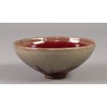 A SMALL CHINESE STONEWARE SONG DYNASTY (960-1279) STYLE BOWL the buff coloured glaze stained with