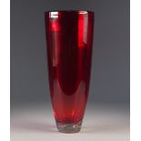 MID TWENTIETH CENTURY RED GLASS VASE, of slender, slightly tapering for, with four bubble inclusions