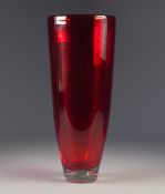 MID TWENTIETH CENTURY RED GLASS VASE, of slender, slightly tapering for, with four bubble inclusions