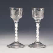 PAIR OF ANTIQUE OPAQUE TWIST WINE GLASSES, each with fruiting vine and butterfly engraved to the