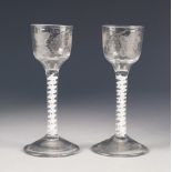 PAIR OF ANTIQUE OPAQUE TWIST WINE GLASSES, each with fruiting vine and butterfly engraved to the