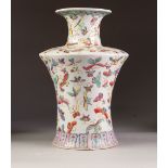 A CHINESE REPUBLIC PERIOD PORCELAIN VASE of archaistic waisted form with short waisted cylindrical