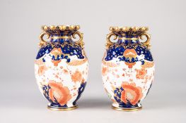 A PAIR OF LATE NINETEENTH CENTURY ROYAL CROWN DERBY PORCELAIN OVOID TWO HANDLED VASES, with