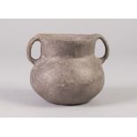 INTERESTING, POSSIBLY ANCIENT TWO HANDLED BURNISHED CLAY POT, 3 ½" (9cm) high