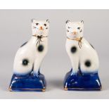 PAIR OF REPRODUCTION 'STAFFORDSHIRE' POTTERY MODELS OF CATS, each modelled seated on a gilt lined