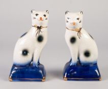 PAIR OF REPRODUCTION 'STAFFORDSHIRE' POTTERY MODELS OF CATS, each modelled seated on a gilt lined