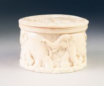 EARLY TWENTIETH CENTURY AFRICAN CARVED IVORY BOX AND COVER, of oval form, carved in low relief