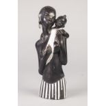 EARLY TWENTIETH CENTURY 'HANDMADE IN AUSTRIA' BLACK GLAZED POTTERY GROUP OF AN AFRICAN MOTHER AND