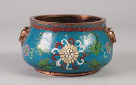 A CHINESE QING DYNASTY BRONZE AND CLOISONNE ENAMEL BOWL of squat ogee form cast with opposing
