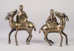 PAIR OF CHINESE CAST BRONZE INCENSE BURNER AND COVER GROUPS, each modelled as a deity riding side