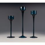 RONALD STENNET WILLSON FOR WEDGWOOD, GRADUATED SET OF THREE BLUE 'SANDRINGHAM' GLASS CANDLESTICKS,