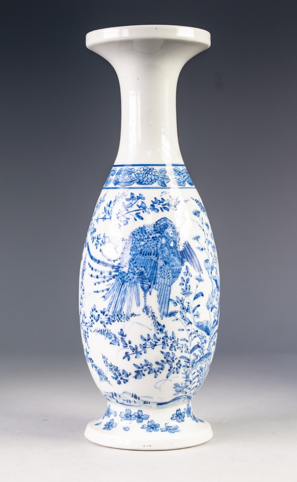 JAPANESE BLUE AND WHITE PORCELAIN VASE, of slender ovoid form with waisted neck and spreading