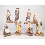 AN UNCOMMON SET OF EIGHT AYNSLEY (1979) BISCUIT PORCELAIN DICKENS CHARACTER FIGURES NAMELY; Artful