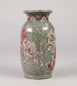 ORIENTAL CRACKLE GLAZED POTTERY VASE, of ovoid form, applied in white with skeletons, on a celadon