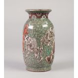 ORIENTAL CRACKLE GLAZED POTTERY VASE, of ovoid form, applied in white with skeletons, on a celadon