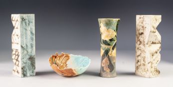 PAIR OF CARN POTTERY SPECIMEN VASES, each of shaped oblong form, glazed in mottled tomes of blue and