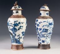 PAIR OF TWENTIETH CENTURY CHINESE CRACKLE GLAZED POTTERY VASES WITH COVERS, each of oviform with dog