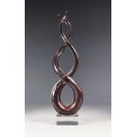 MURANO PALE PINK CASED GLASS 'LOVE KNOT' SCULPTURE, raised on a clear glass oblong base, unmarked,