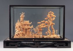 EARLY TWENTIETH CENTURY ORIENTAL CARVED CORK DIORAMA, depicting a temple and trees in a river