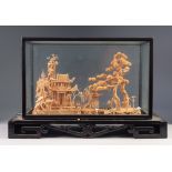 EARLY TWENTIETH CENTURY ORIENTAL CARVED CORK DIORAMA, depicting a temple and trees in a river