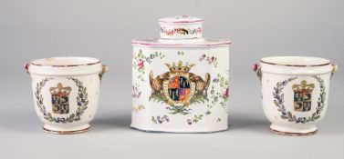 EARLY TWENTIETH CENTURY FRENCH FAIENCE POTTERY ARMORIAL TEA CADDY AND COVER, of canted oblong form