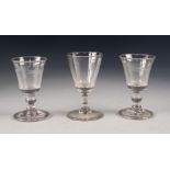 PAIR OF ANTIQUE STEMMED DRINKING GLASSES, each with flared bowl, wheel cut with wheat sheaves, above