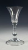 ANTIQUE WINE GLASS, with bell shaped bowl, knopped, cylindrical stem and conical, folded foot,